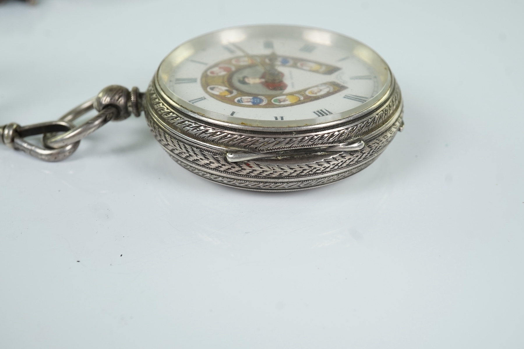 A late Victorian Horse Racing related engraved silver open faced keywind pocket watch, by J. Vickers, Leicester Road, Coventry, the enamelled dial with a signed painted bust of the jockey Fred Archer to the centre and fl